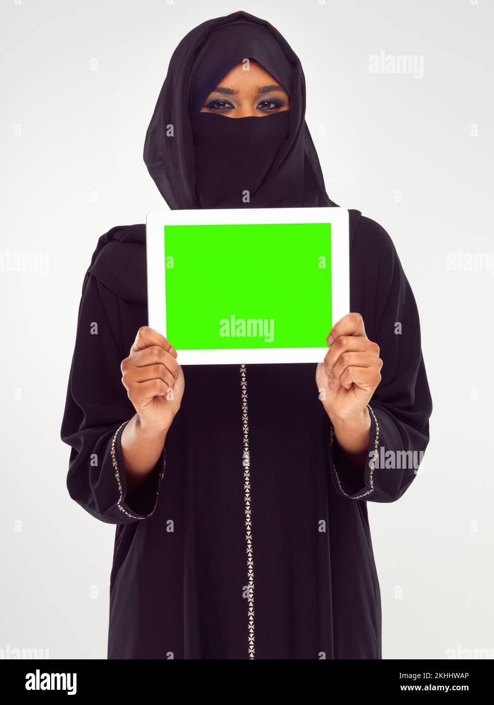 Supporting modern technology. Studio shot of a woman in a burqa using a digital tablet. Stock Photo