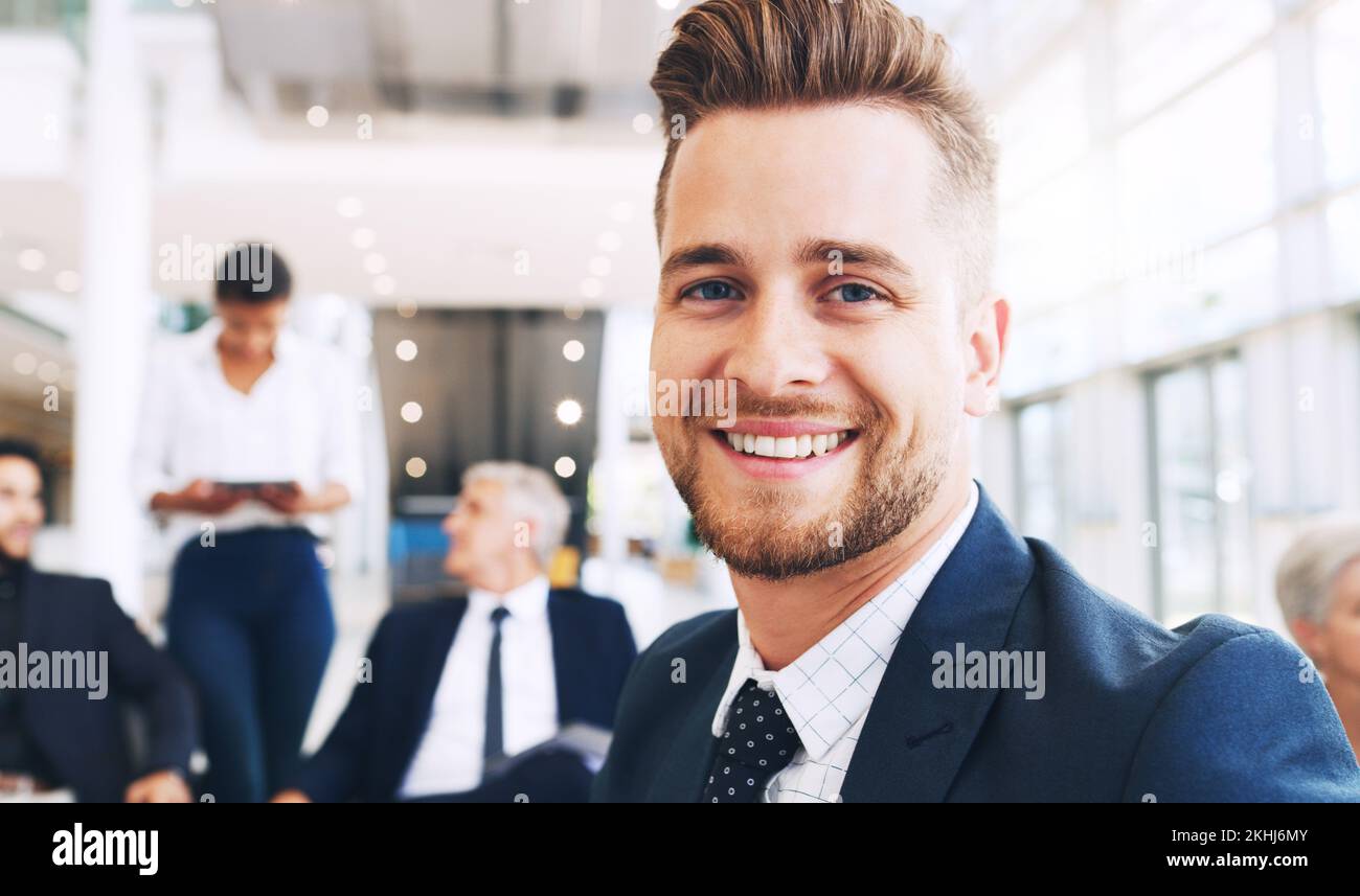Portrait, businessman and business meeting in office building with team for planning, strategy and startup proposal. Face, employee and man happy Stock Photo