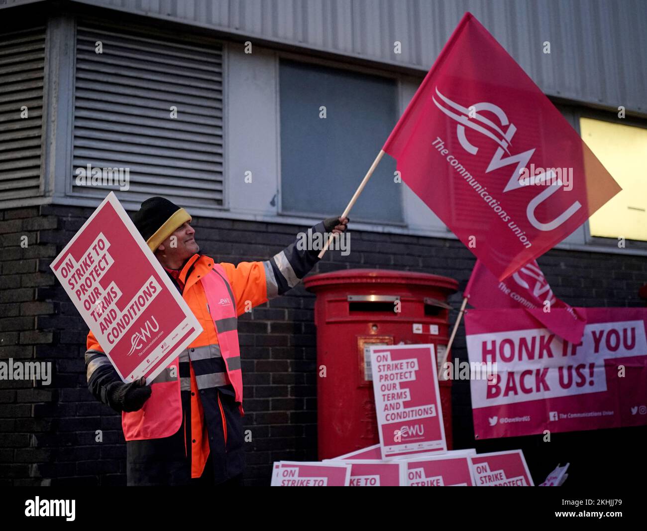 A postal worker from the Communication Workers Union (CWU) on the picket line at the Camden Town Delivery Office in north west London. Members of the Communication Workers Union (CWU) are holding a 48-hour strike in a long-running dispute over jobs, pay and conditions. Picture date: Thursday November 24, 2022. Stock Photo