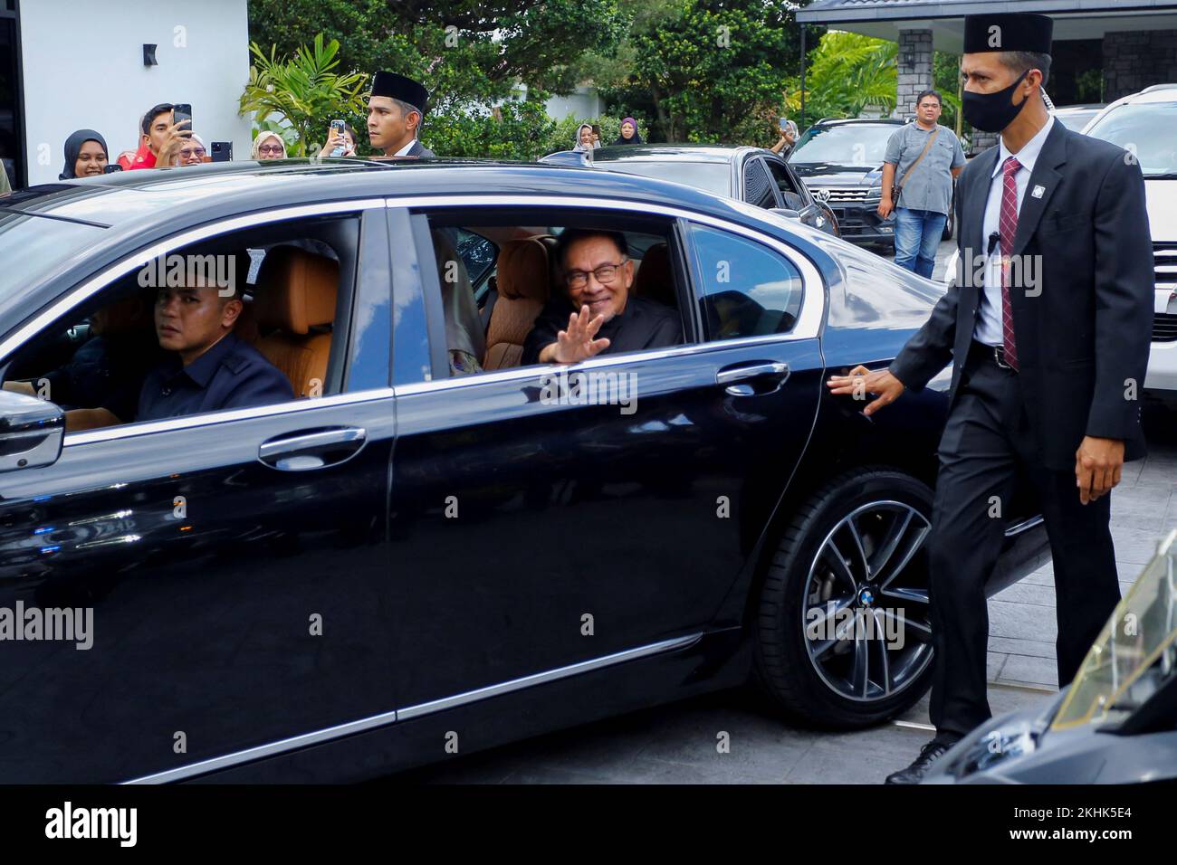 Malaysia's new Prime Minister Anwar Ibrahim gestures as he leaves his house in Kajang, Malaysia November 24, 2022. REUTERS/Lai Seng Sin Stock Photo