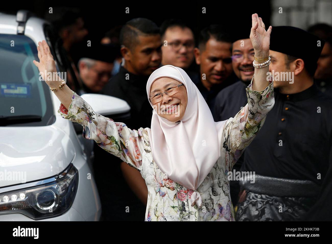 Wan Azizah, wife of Malaysia's new Prime Minister Anwar Ibrahim, gestures outside their house in Kajang, Malaysia November 24, 2022. REUTERS/Lai Seng Sin Stock Photo
