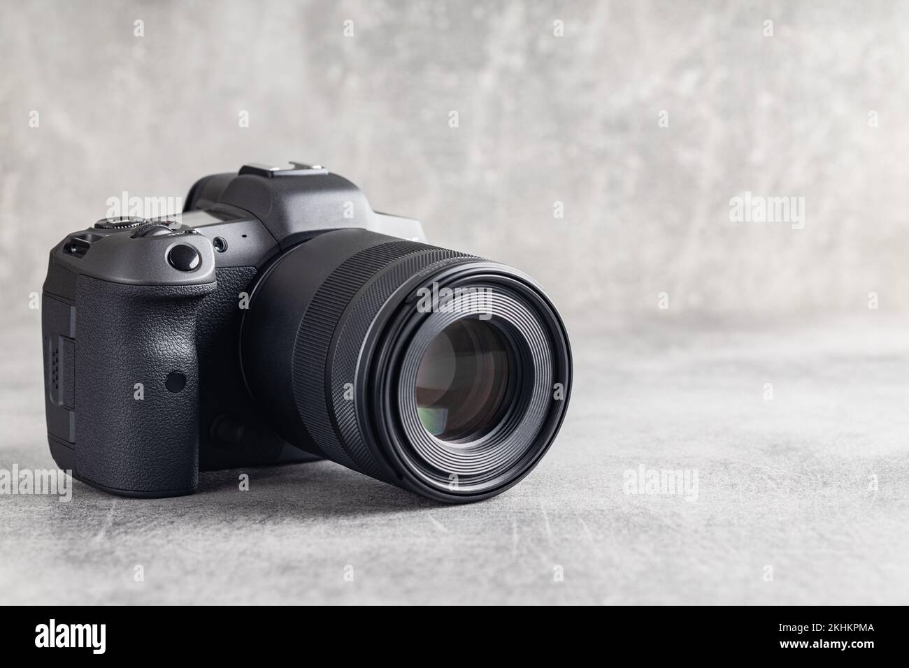 Digital mirrorless camera on the gray table Stock Photo - Alamy