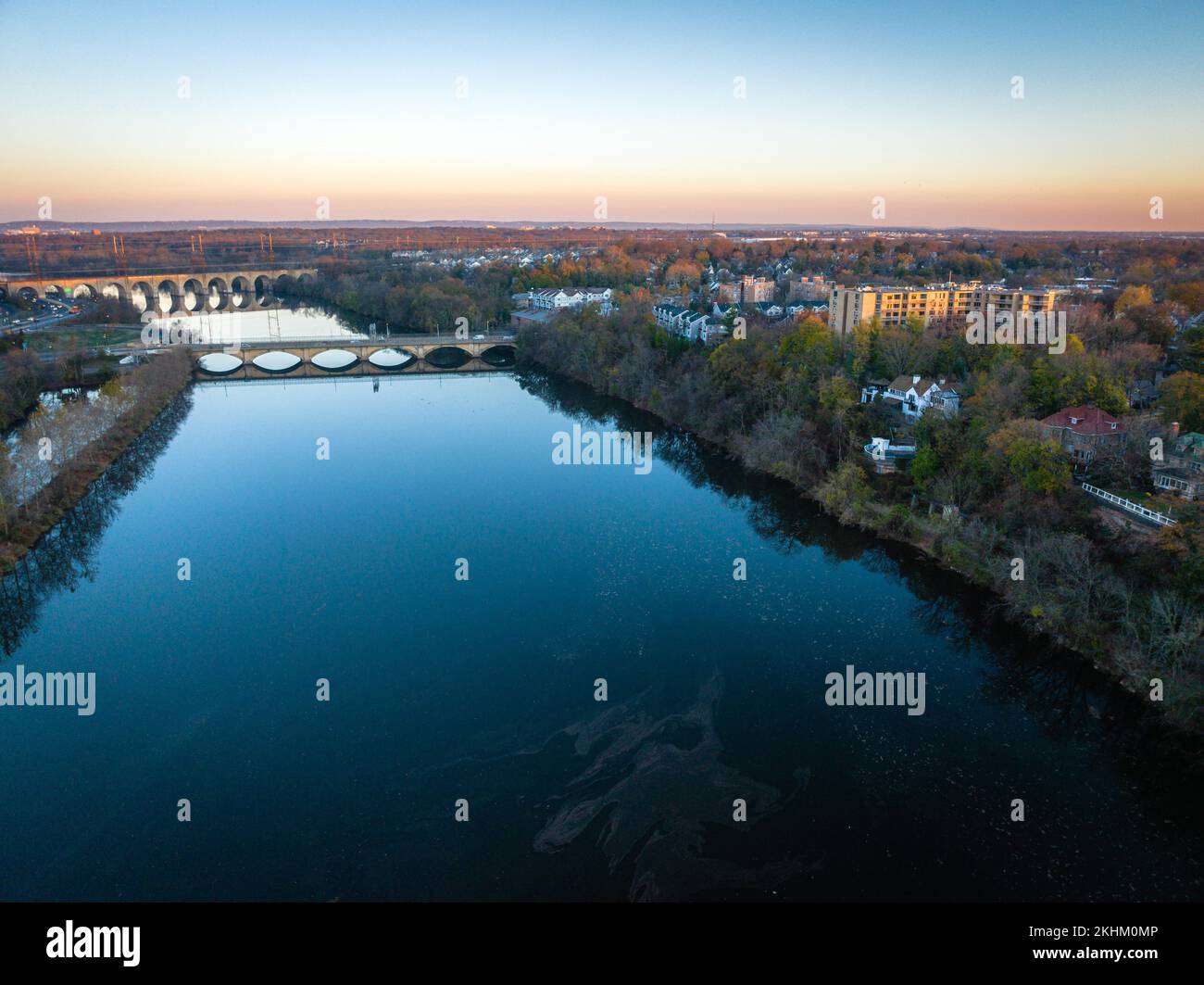 Nb Rivers A drone view of a blue river reflected from the sky with a bridge ...