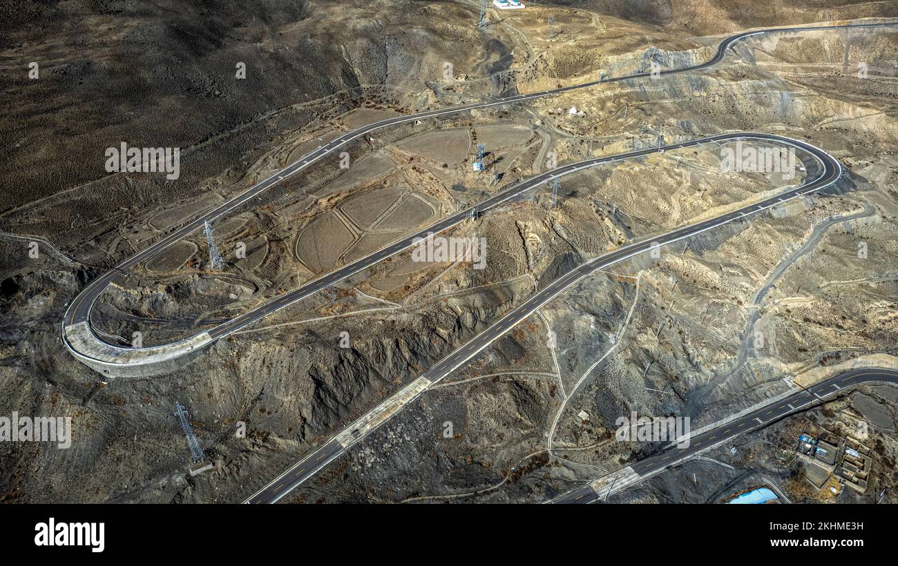 A high drone over Highways of Luozha Grand Canyon, Shannan City, Tibet, China with rocky lands Stock Photo