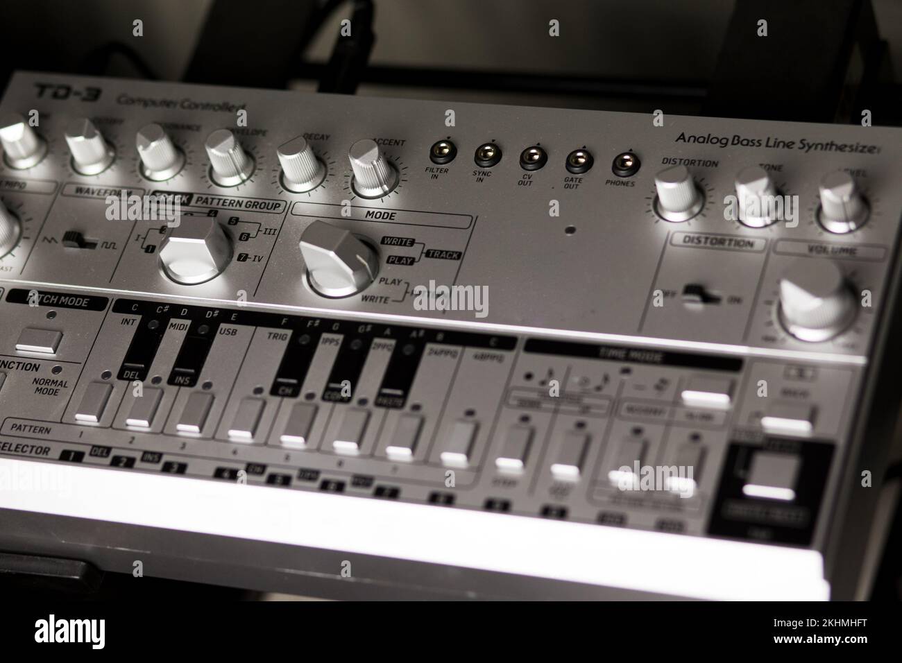 Analog bassline synthesizer in silver, 303 style on a rack Stock Photo