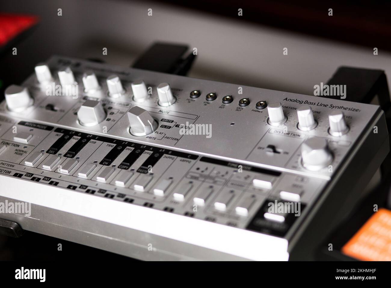 Analog bassline synthesizer in silver, 303 style on a rack Stock Photo