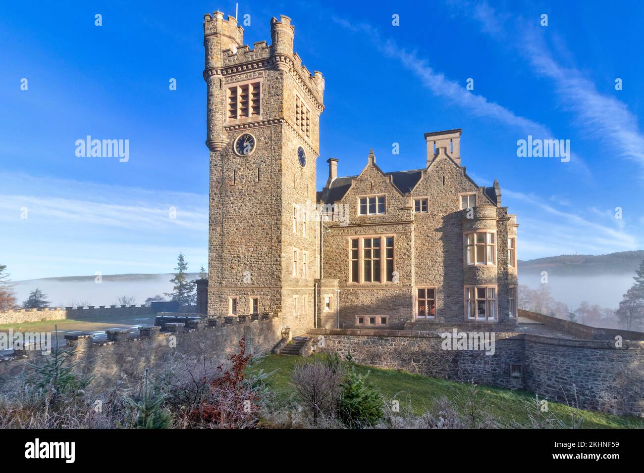 Carbisdale Castle Invershin Scotland blue sky and early morning mist over the Kyle of Sutherland Stock Photo