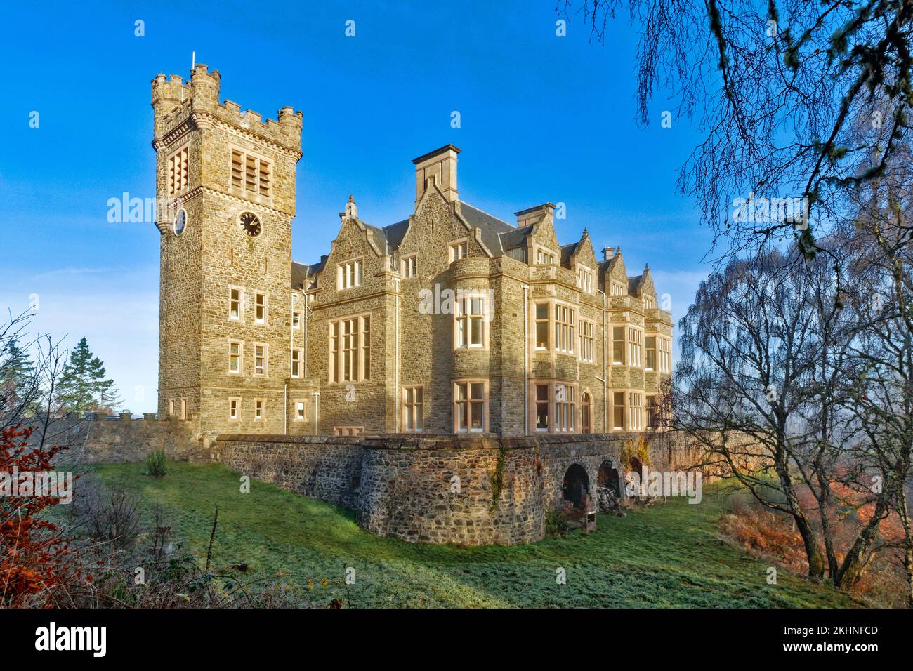 Carbisdale Castle Invershin Scotland blue sky over the building and garden in early winter Stock Photo