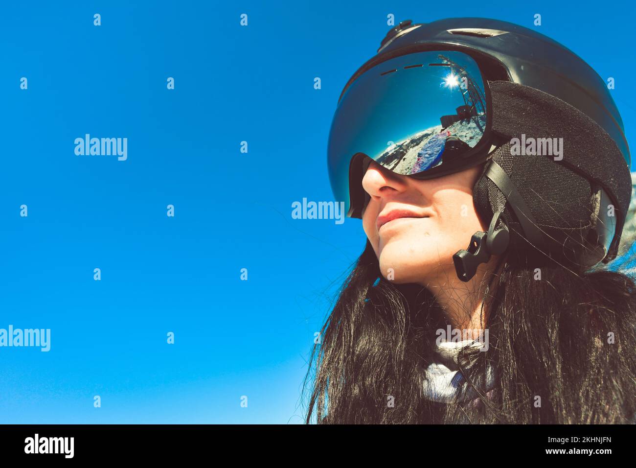 Close up skiers female person goggles with mountains panorama reflection. Ski holiday in caucasus mountains Stock Photo