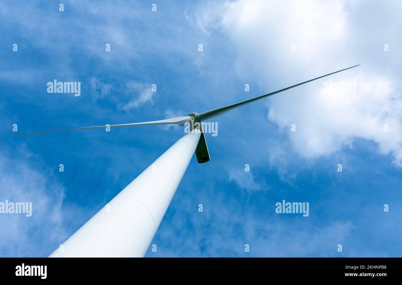 wind turbine against blue sky with white clouds Stock Photo - Alamy