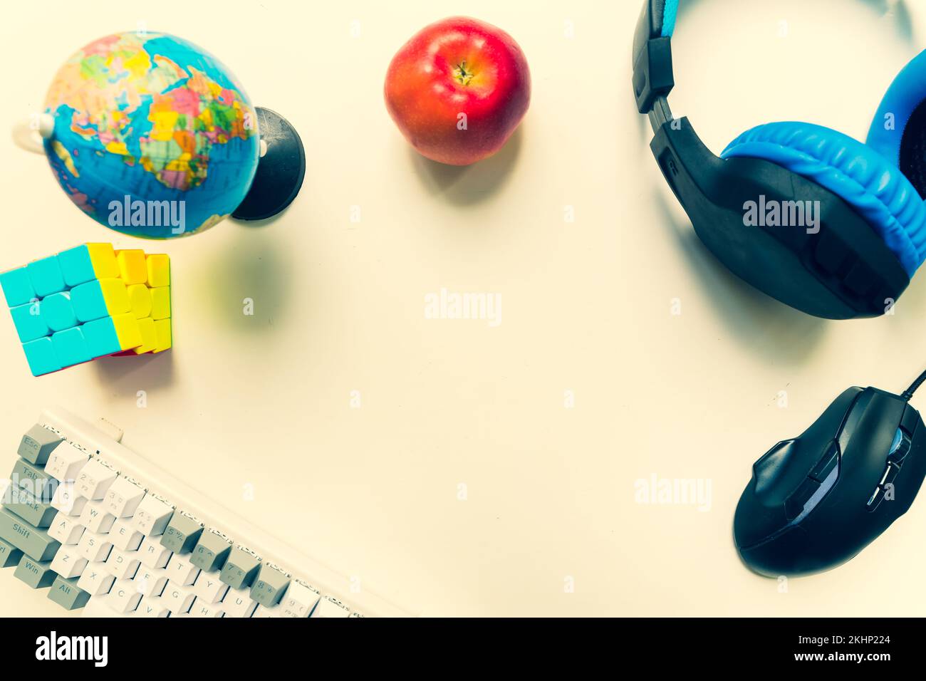 Top view kids desktop beginner player keyboard workspace concept, top view a gaming gear, mouse, keyboard, headset, on white table background with cop Stock Photo