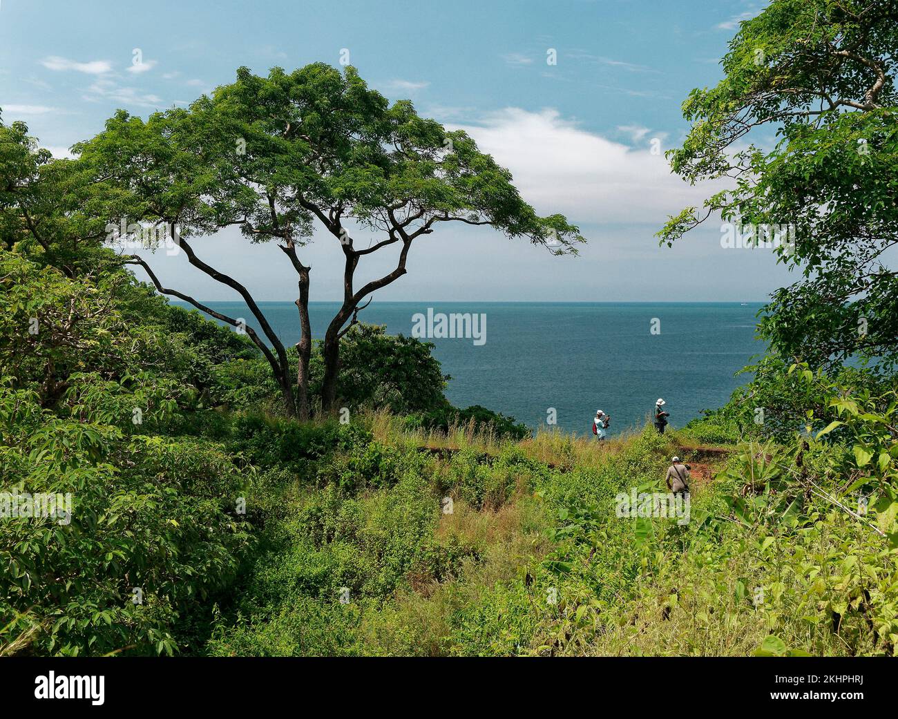 Tourist taking photo of ruins of Cabo de Rama Fort and Arabian Sea in Goa India 10 14 2022 Stock Photo