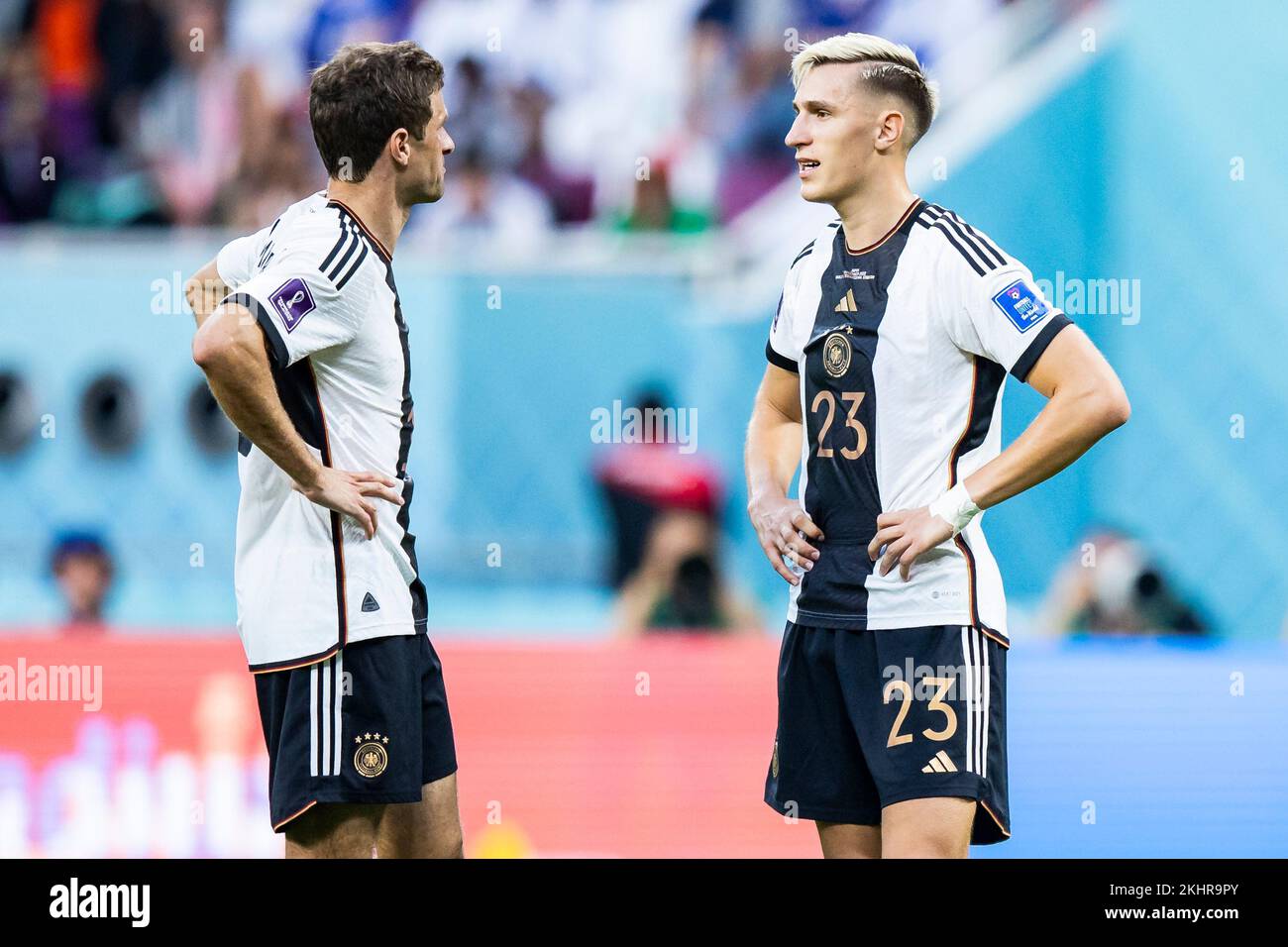 Ar Rayyan, Qatar. 23rd Nov, 2022. Soccer: World Cup, Germany - Japan, preliminary round, Group E, Matchday 1, Chalifa International Stadium, Germany's Thomas Müller (l) and Germany's Nico Schlotterbeck (r) react during the match. Credit: Tom Weller/dpa/Alamy Live News Stock Photo