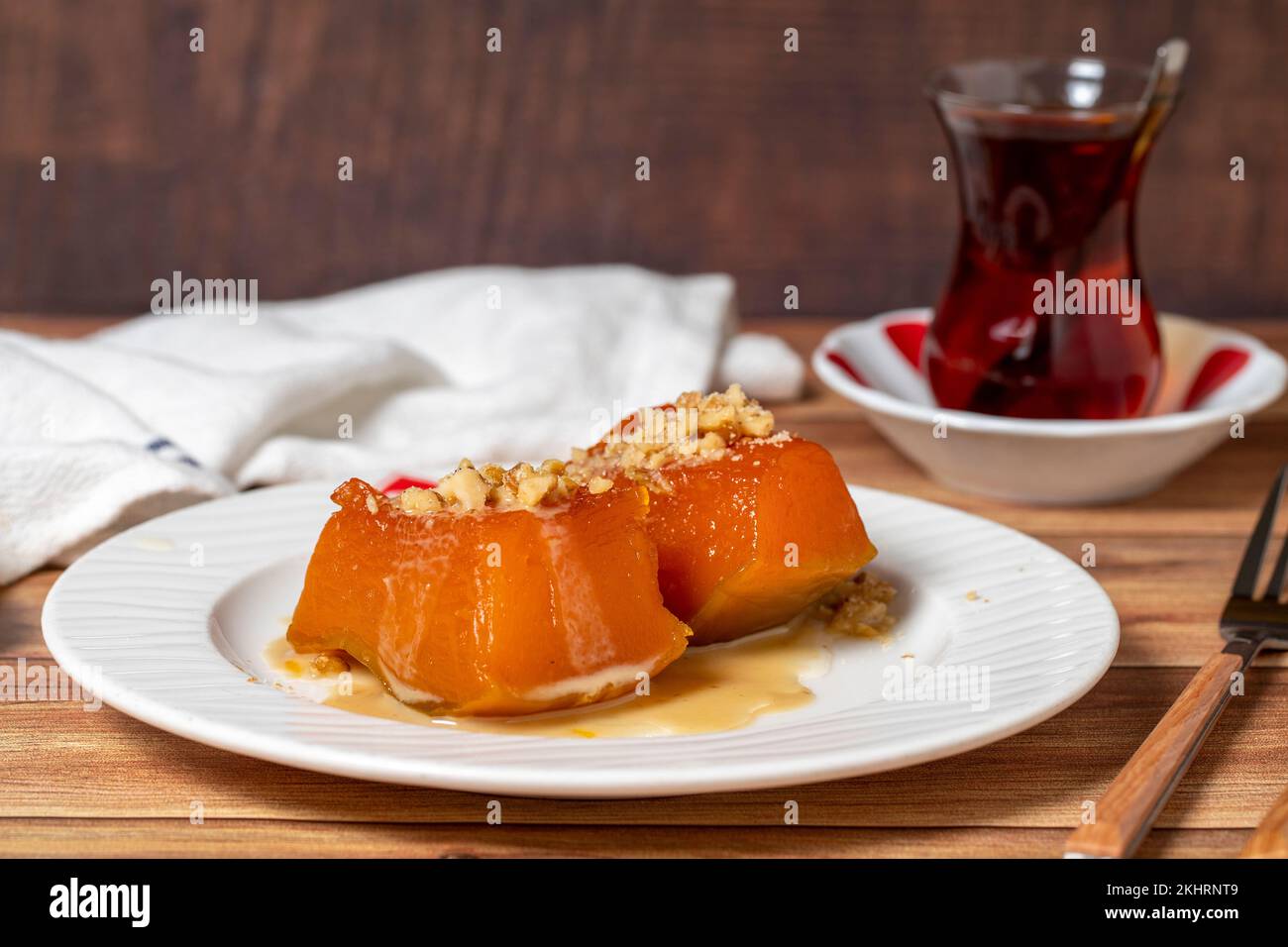 Zucchini dessert with tahini. Traditional Turkish cuisine delicacies. Local name tahinli kabak tatlisi. close up Stock Photo