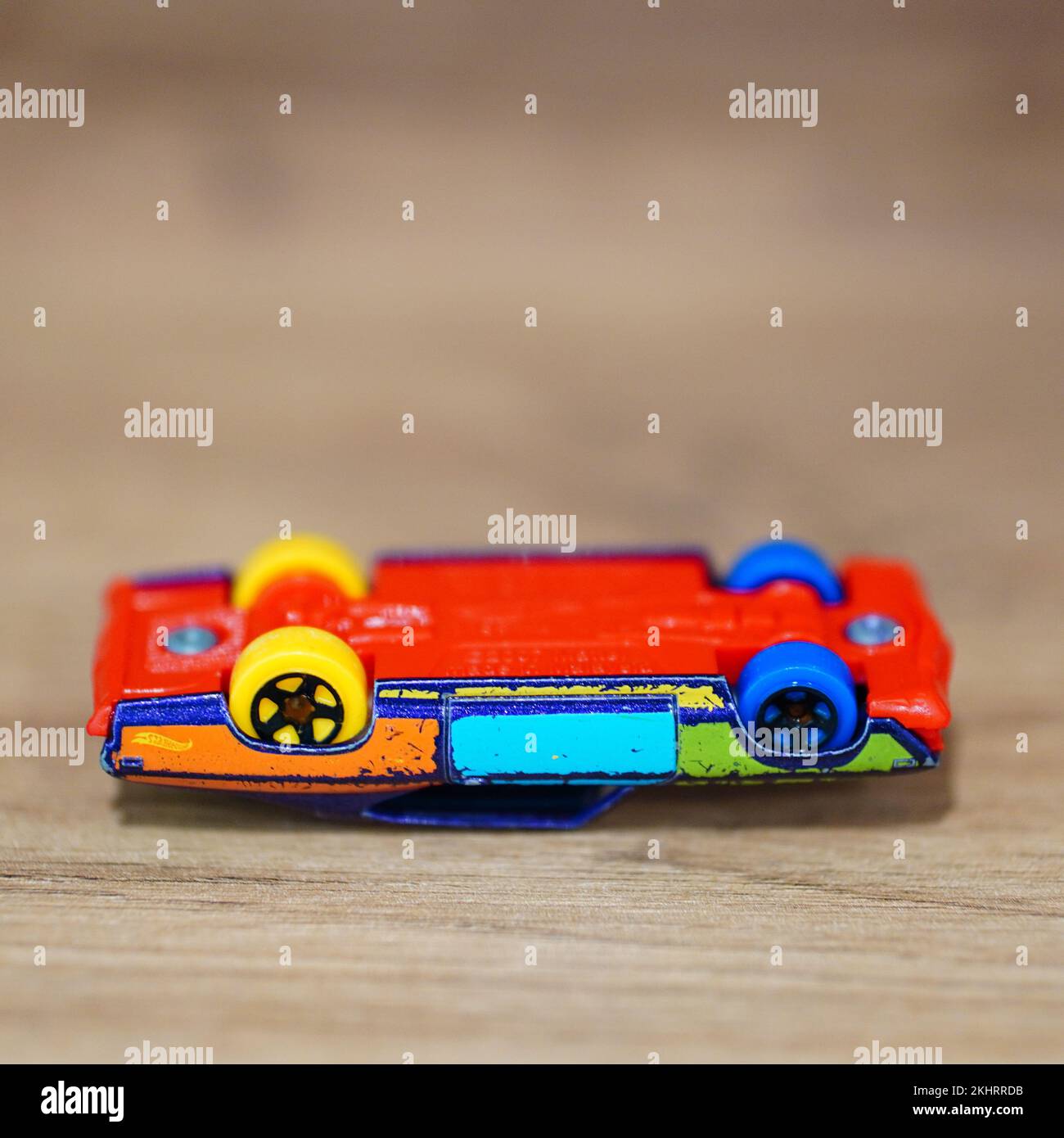 A vertical closeup of a Hot Wheels colorful 69 Chevelle toy model car ...
