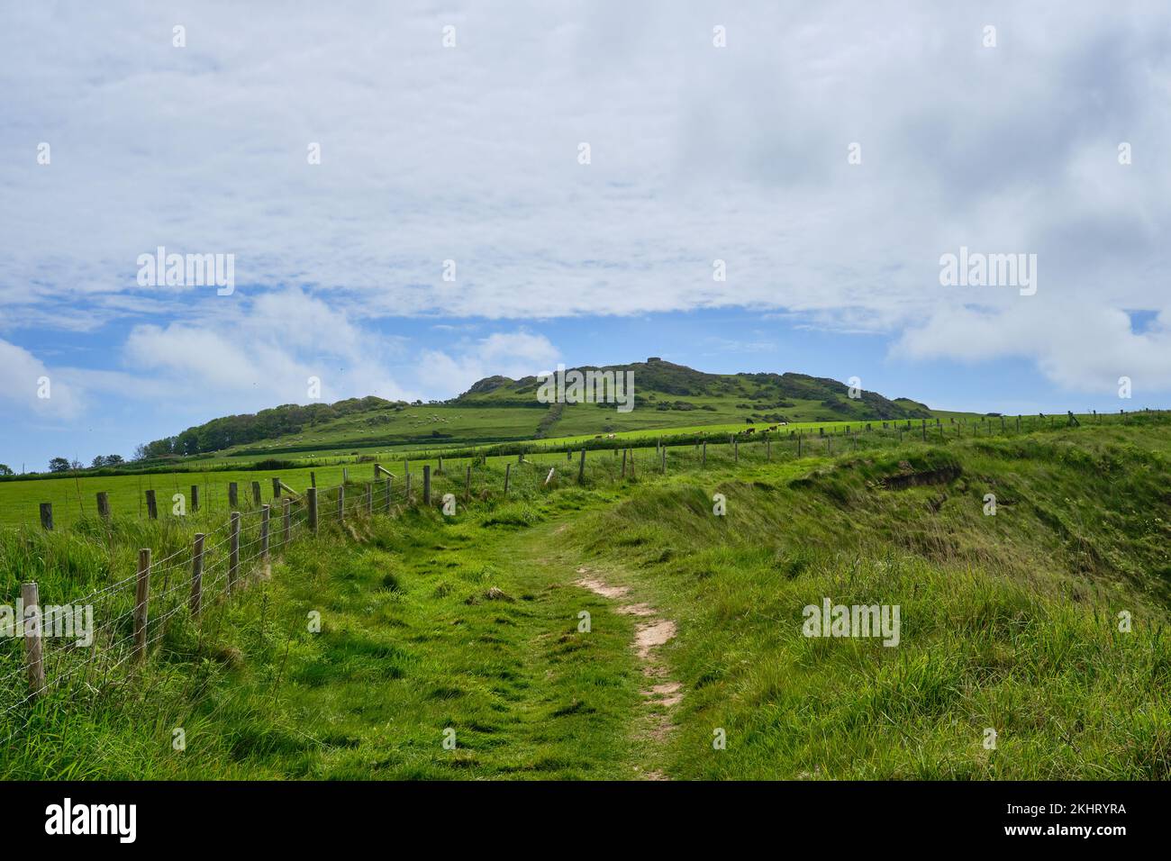 Mynydd Carreg with its distinctive stone turret at Porthor, Wales Stock Photo