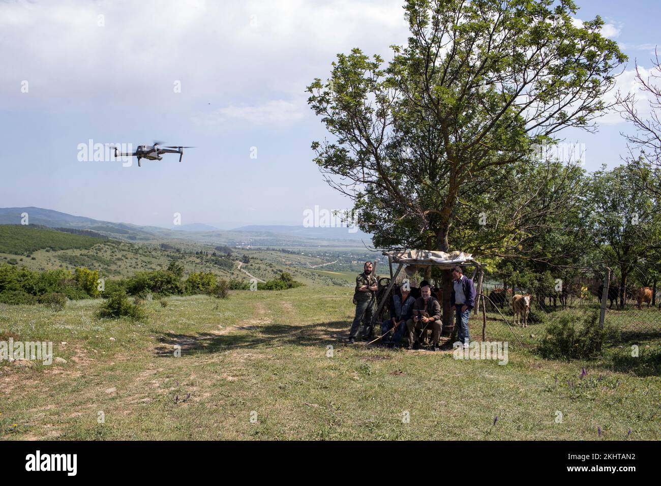 Georgian 'anti-occupation' activist David Katsarava, the leader of the group 'Power is in Unity', and his team patrol an area with a drone, where Katsarava said a local had been kidnapped and later released, near the border of Georgia's breakaway region of South Ossetia, near Karkushaani village, Georgia, June 15, 2021. Katsarava hands out GPS trackers to shepherds and other residents to locate them rapidly if they run into trouble on the frontier so they can refute claims they have flouted it. He says Georgia has already lost tracts of land beyond the territory it initially lost control of. ' Stock Photo
