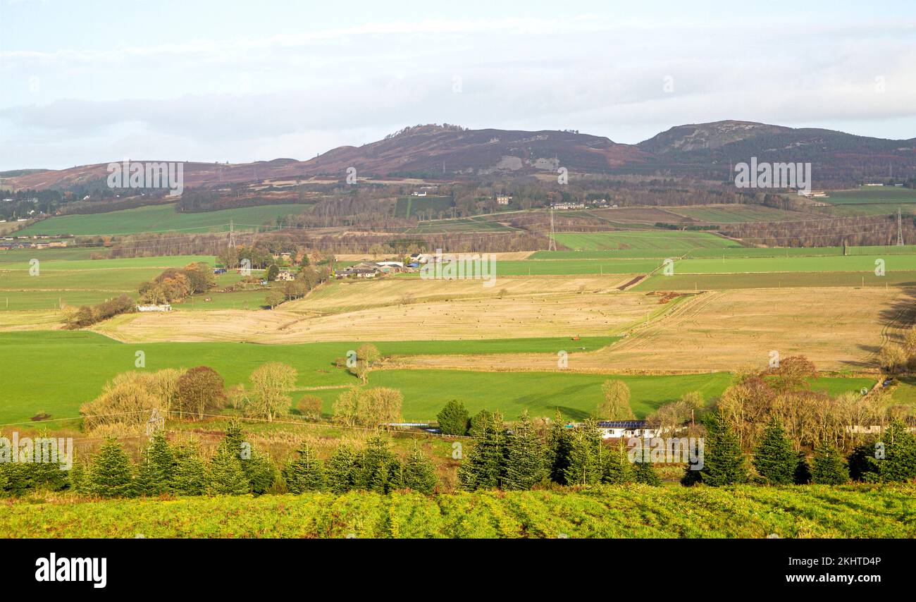 Dundee, Tayside, Scotland, UK. 24th Nov, 2022. UK Weather: Northeast Scotland is enjoying beautiful late November sunshine with highs around 10°C. A breath-taking winter landscape view of rural Dundee's Strathmore Valley and Sidlaw Hills. The Sidlaw Hills in Dundee have quite a diverse plant life, significant antiquities, and a unique role in scientific history as the site of an 18th-century experiment in 'weighing the earth.' Credit: Dundee Photographics/Alamy Live News Stock Photo