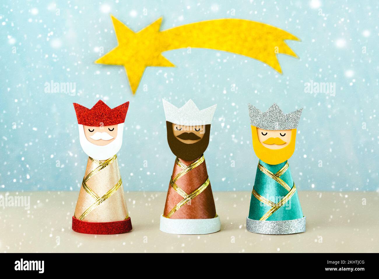 The three wise men with golden star and snowflakes over blue background. Concept for Reyes Magos day,Three Wise Men Stock Photo