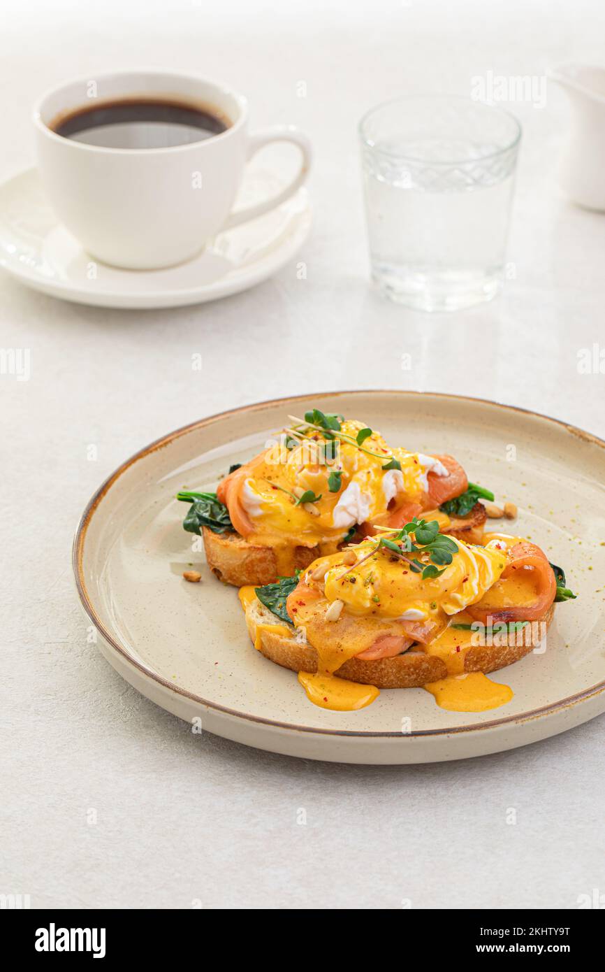 Portion of eggs benedict toast with salmon Stock Photo