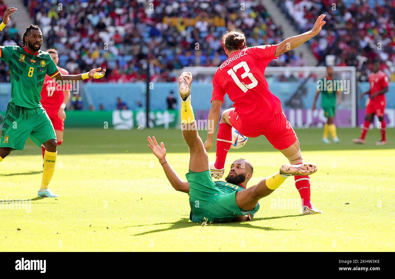 Al Wakrah, Qatar. 24th Nov, 2022. Bryan Mbeumo (bottom) of Cameroon vies with Ricardo Rodriguez (top R) of Switzerland during the Group G match between Switzerland and Cameroon at the 2022 FIFA World Cup at Al Janoub Stadium in Al Wakrah, Qatar, Nov. 24, 2022. Credit: Wang Dongzhen/Xinhua/Alamy Live News Stock Photo