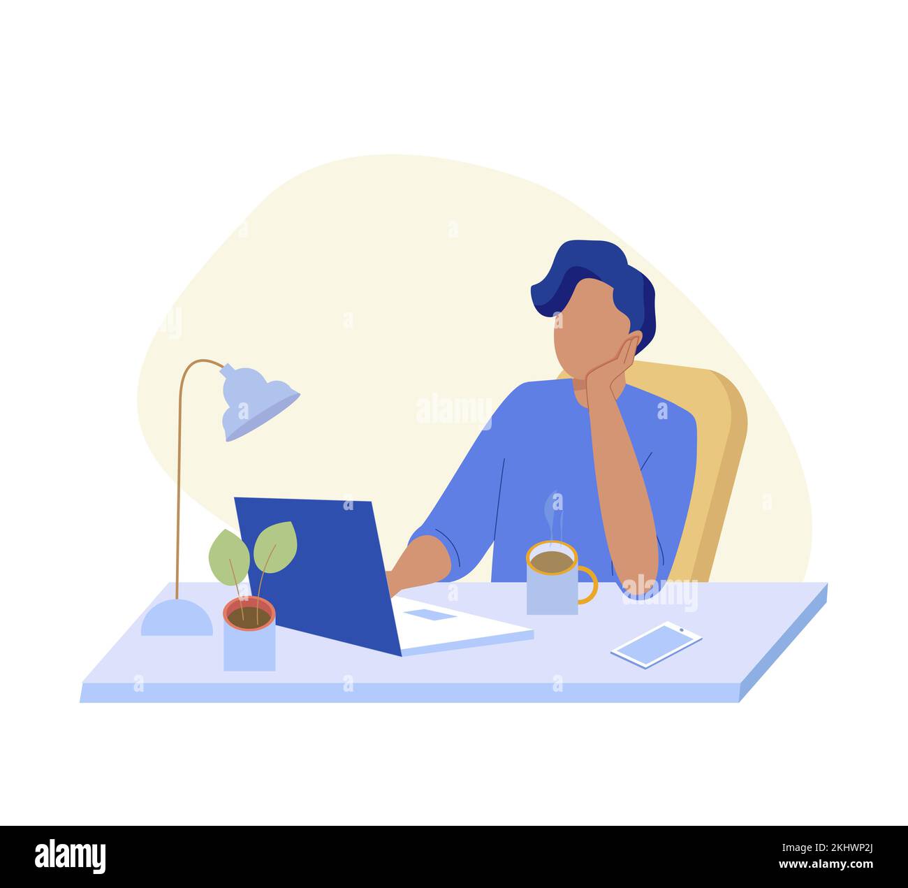 Man works at the office at the computer and props his head with his