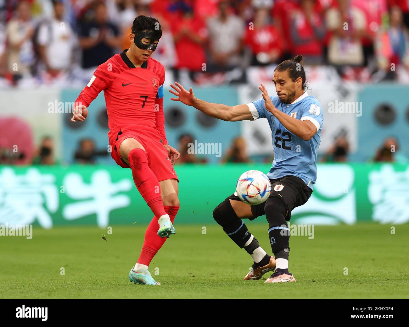 Ar Rayyan, Qatar. 24th Nov, 2022. Heung min Son of Korea challenged by Martin Caceres of Uruguay during the FIFA World Cup 2022 match at Education City Stadium, Ar Rayyan. Picture credit should read: David Klein/Sportimage/Alamy Live News/Alamy Live News/Alamy Live News/Alamy Live News Credit: Sportimage/Alamy Live News Stock Photo