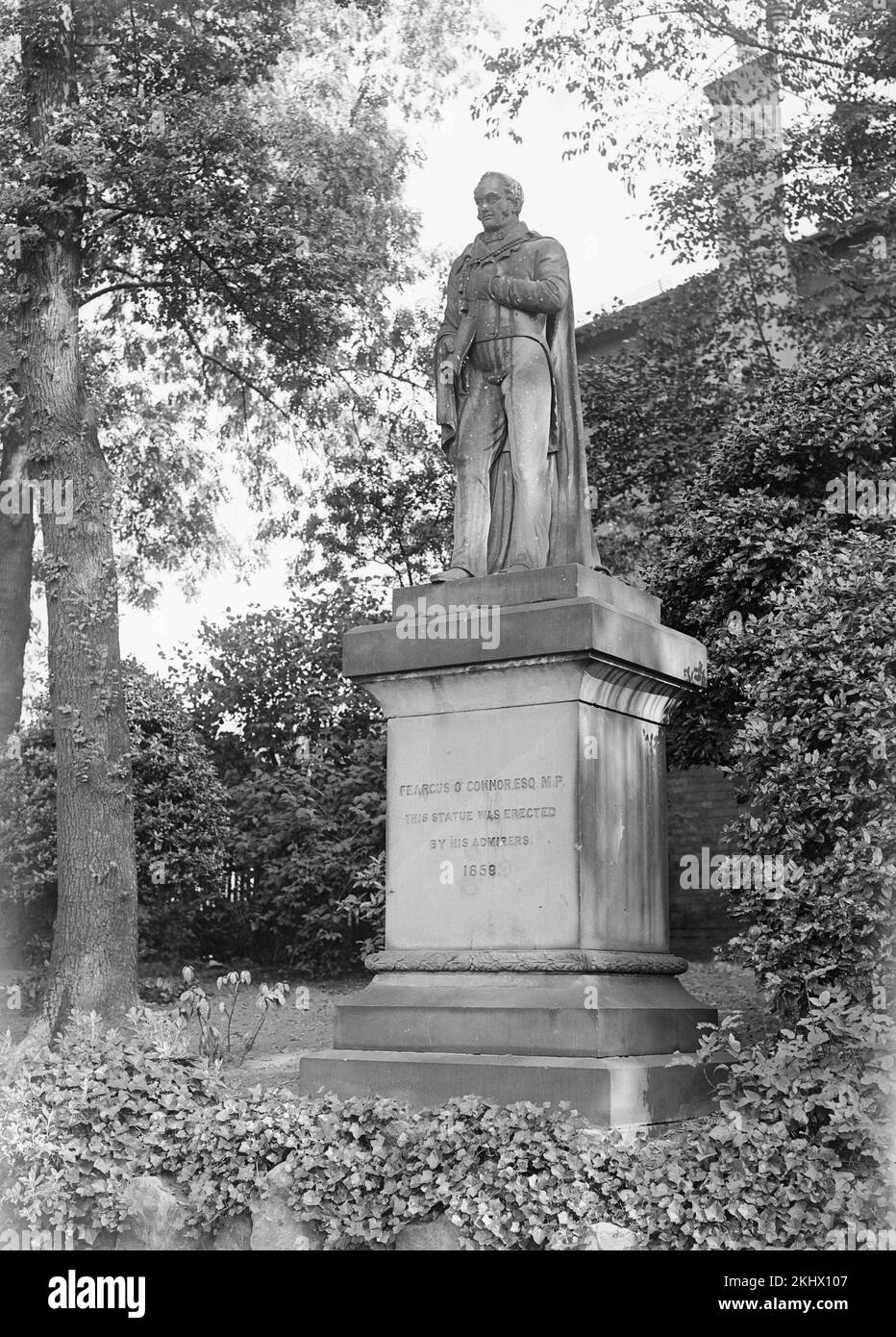 A late Victorian black and white photograph showing the statue of  the Chartist Feargus O'Connor in Nottingham Arboretum. Stock Photo