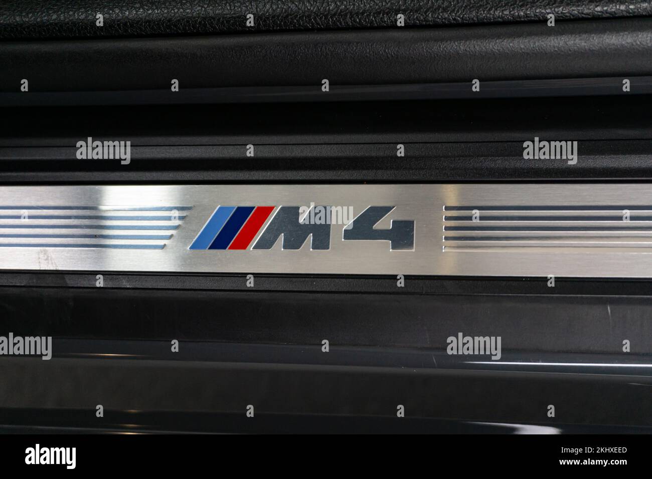 A closeup of BMW M4 door sill logo Stock Photo Alamy