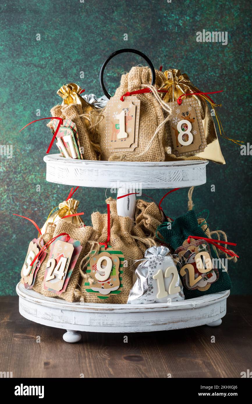 Straight on view of a homemade Advent calendar on a tiered stand. Stock Photo