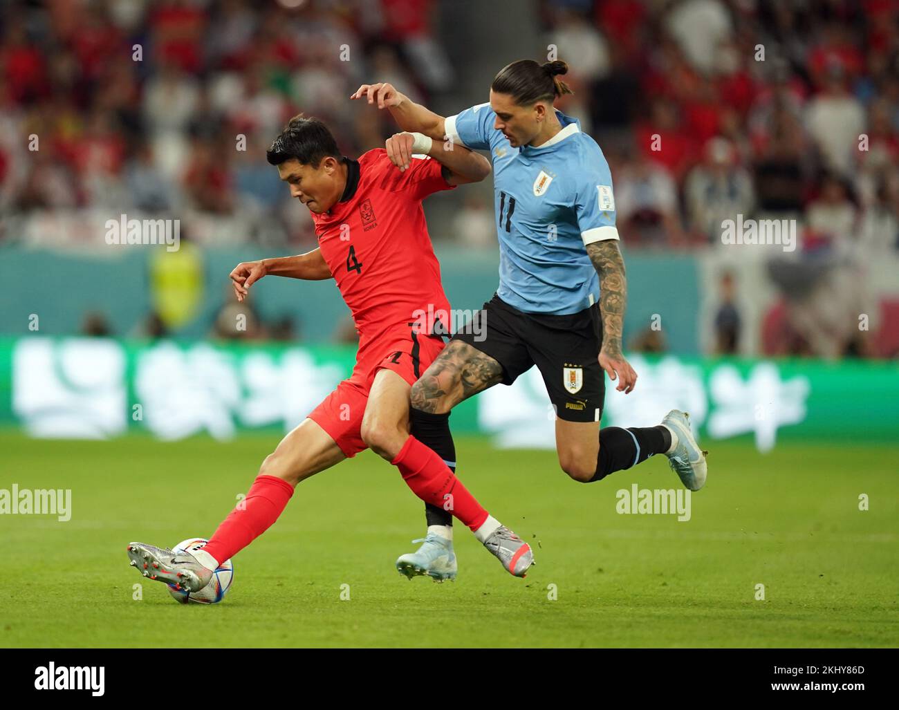 South Korea's Kim Min-jae and Uruguay's Darwin Nunez (right) battle for the ball during the FIFA World Cup Group H match at the Education City Stadium, Doha, Qatar. Picture date: Thursday November 24, 2022. Stock Photo