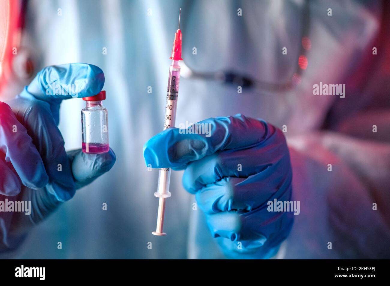 Medical hand glove blue vial vaccine hypodermic needle syringe injection treatment. Lab test immunization and vaccination concept. drug insulin care Stock Photo