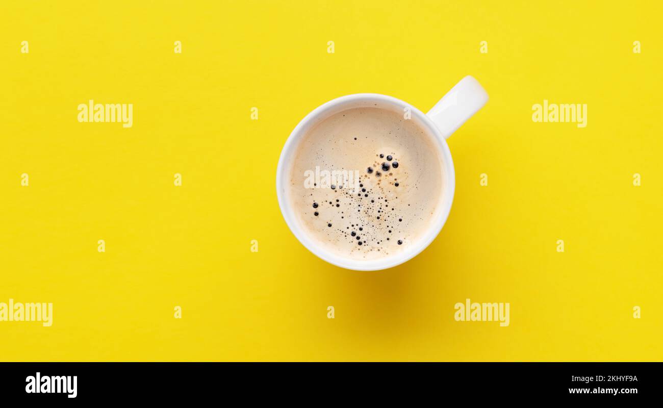 Espresso coffee on yellow background. Flat lay with copy space Stock Photo