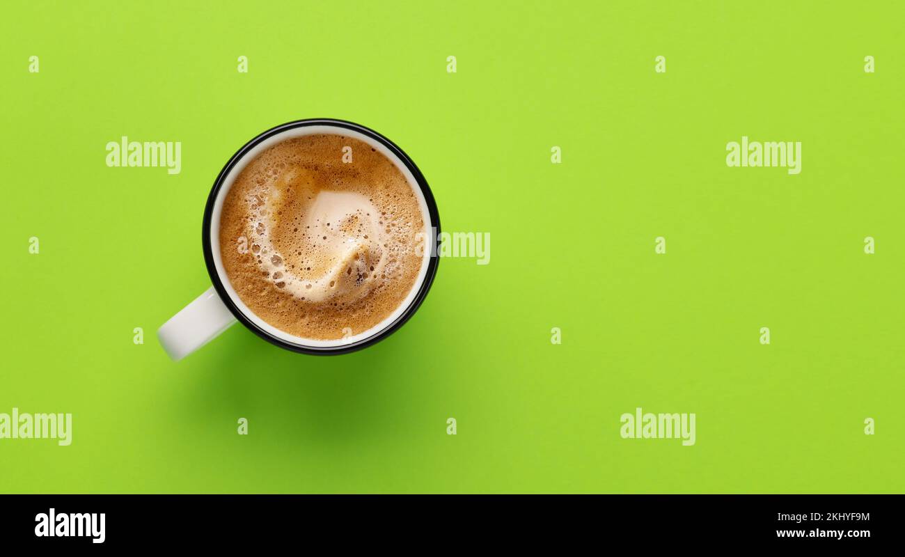 Espresso coffee on green background. Flat lay with copy space Stock Photo