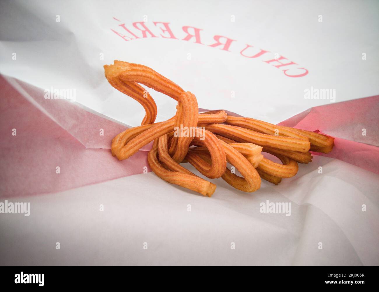 Artisan ring churros in bag. Photo taken from inside the paper bag Stock Photo