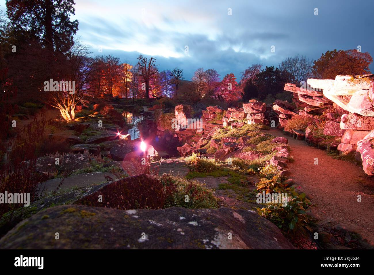 Illuminated rock garden at night Stock Photo - Alamy