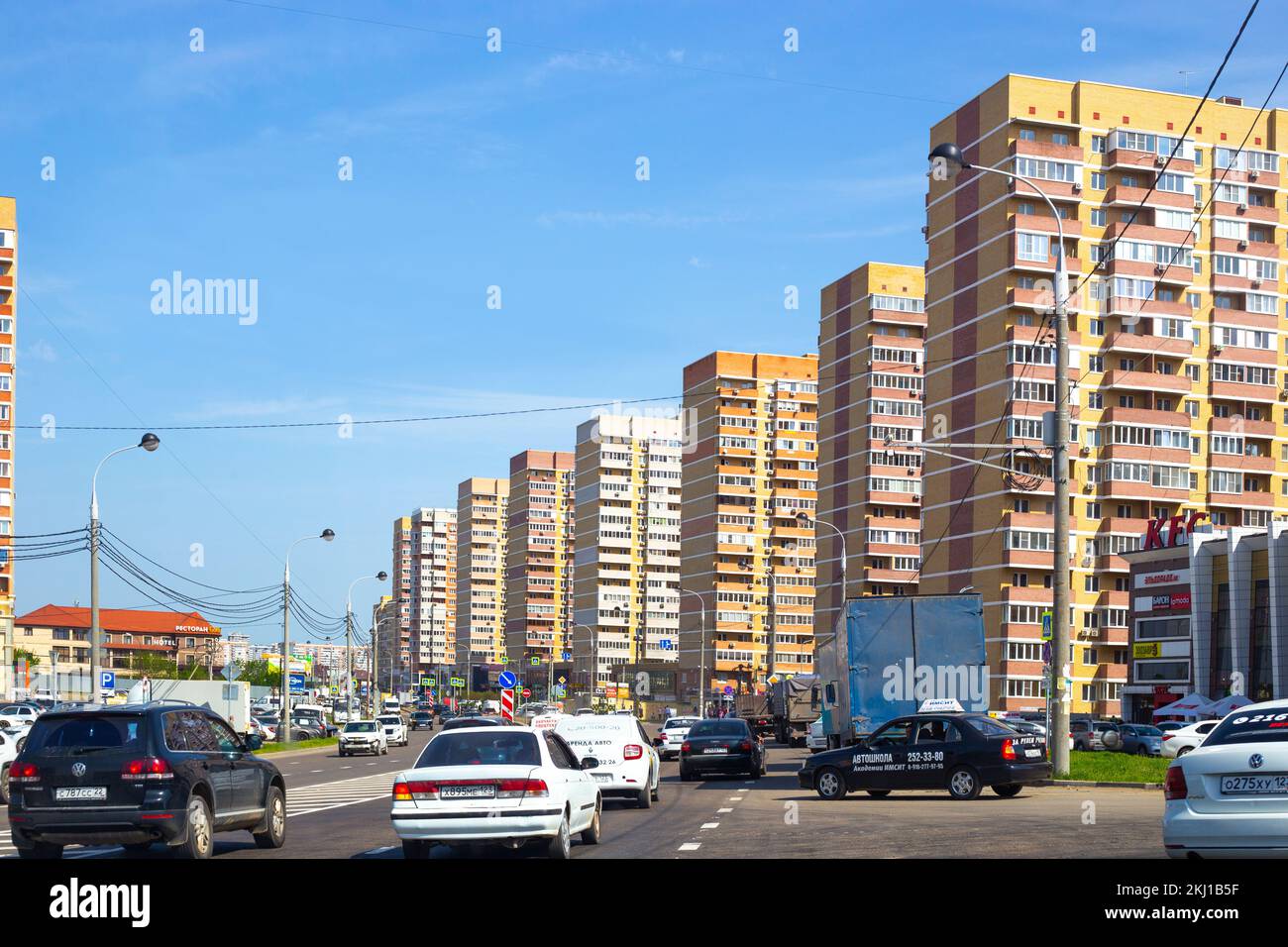 Crossroads on the street of a big city in a developing area with high-rise buildings. Russia, Krasnodar-24.04.2022 Stock Photo