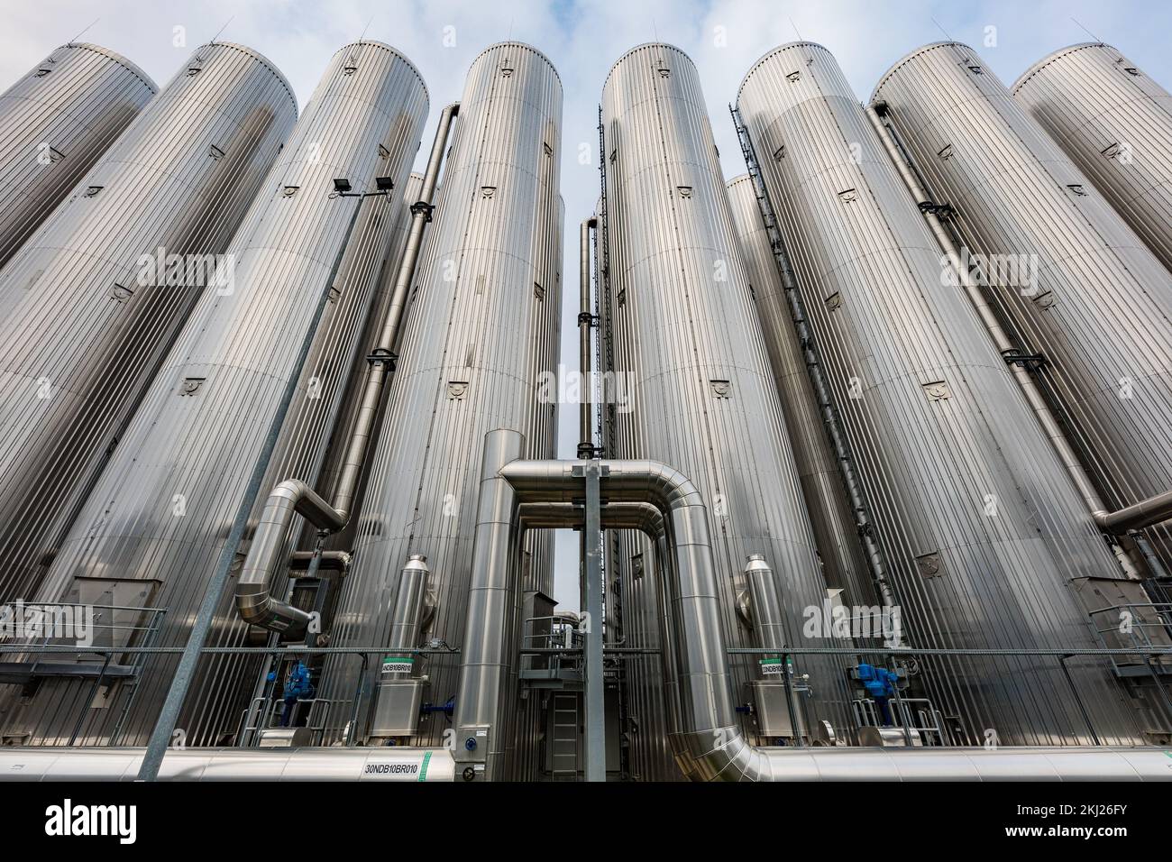 Image showcasing 24 November 2022, Brandenburg, Cottbus: 15 heat storage tanks with a ...