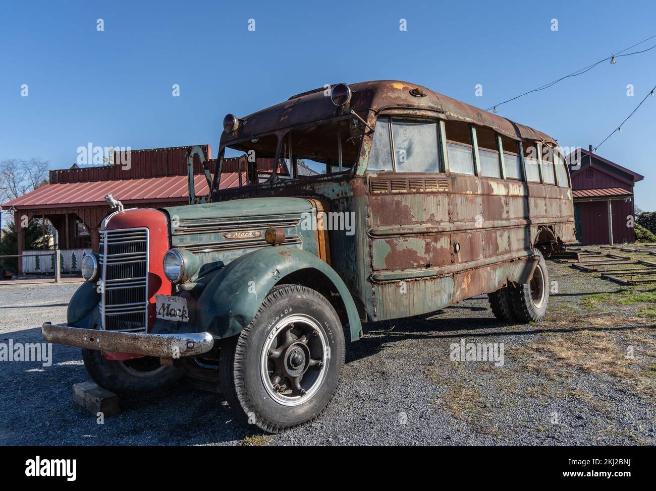 Berks County, Pennsylvania – November 22, 2022: Old Mack Bus parked at Christmas Tree Farm as holiday decoration: Mack Trucks, Inc., is an American tr Stock Photo