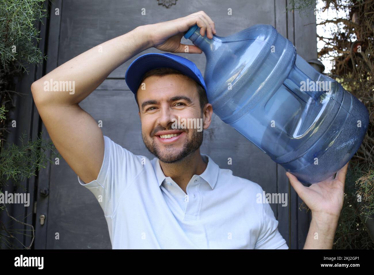 https://c8.alamy.com/comp/2KJ2GP1/water-delivery-guy-all-in-blue-outfit-2KJ2GP1.jpg