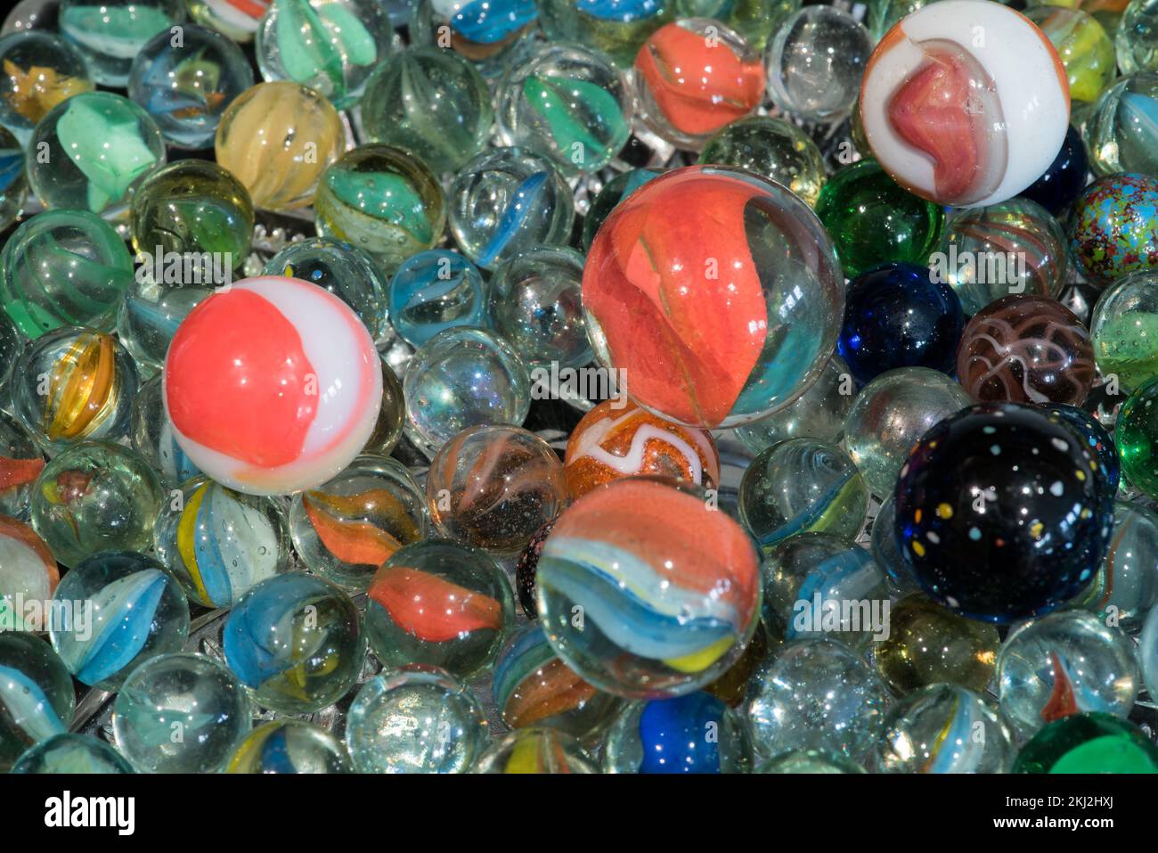 A colourful mixture of vintage marbles including some cat's eyes (cats