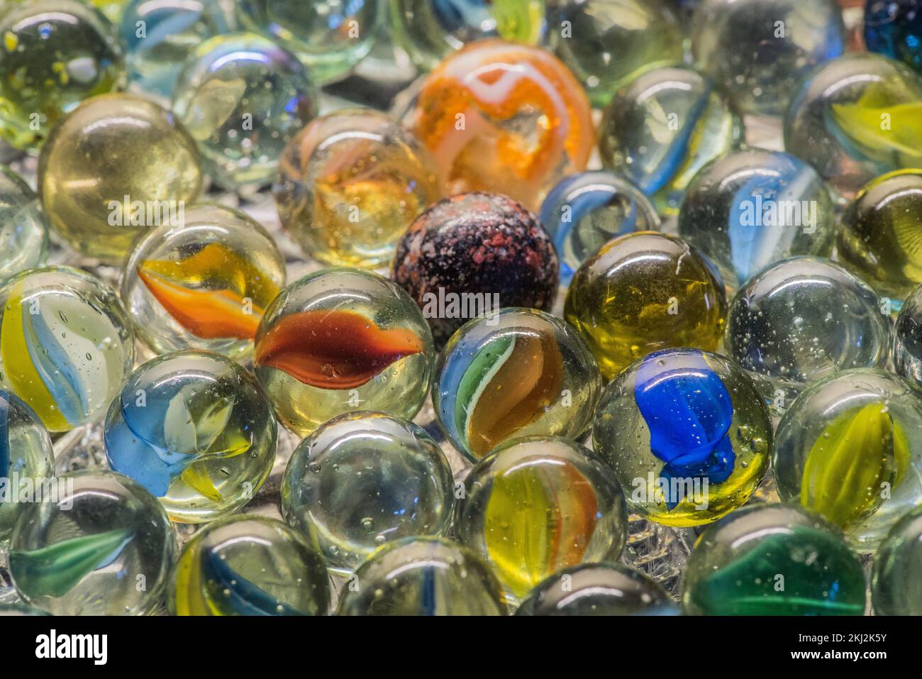 A colourful mixture of vintage marbles including some cat's eyes (cats