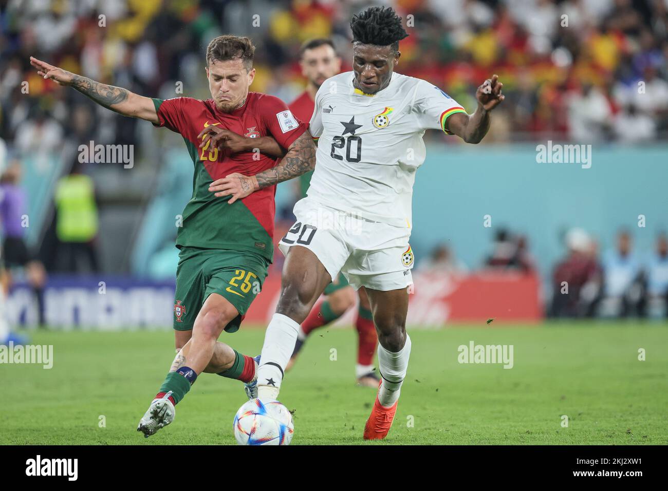 Portuguese Otavio and Ghana's Mohammed Kudus fight for the ball during a soccer game between Portugal and Ghana, in Group H of the FIFA 2022 World Cup in Doha, State of Qatar on Thursday 24 November 2022. BELGA PHOTO BRUNO FAHY Credit: Belga News Agency/Alamy Live News Stock Photo