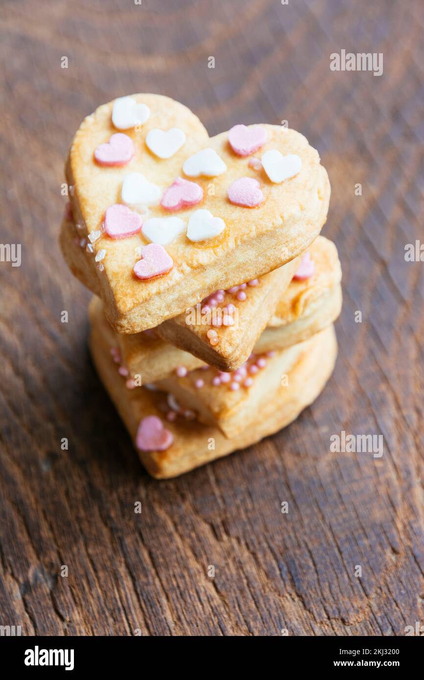 Stack of home made hearth shaped cookies Stock Photo