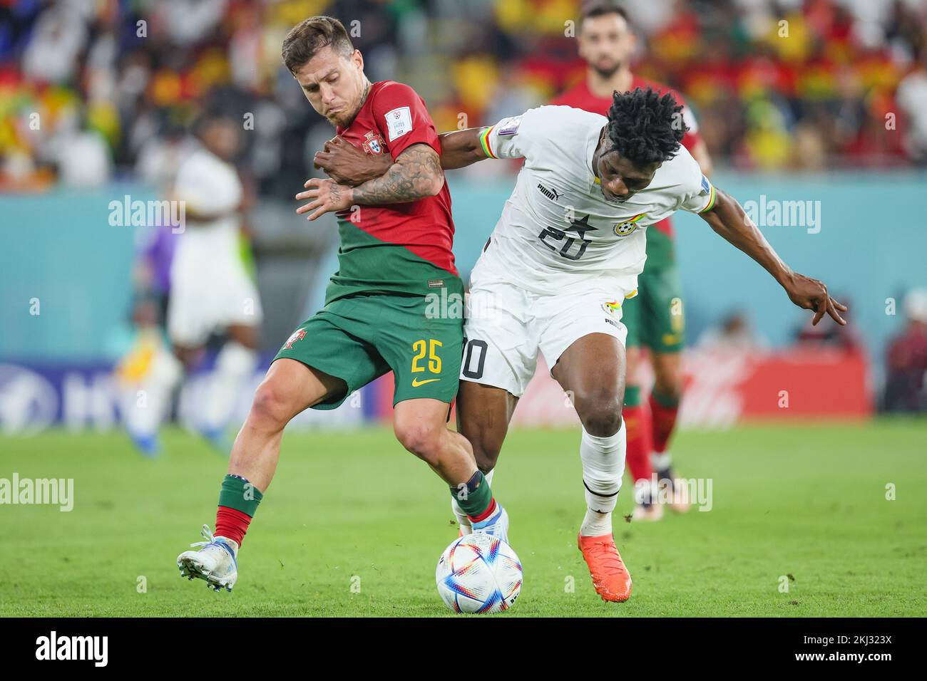 Portuguese Otavio and Ghana's Mohammed Kudus fight for the ball during a soccer game between Portugal and Ghana, in Group H of the FIFA 2022 World Cup in Doha, State of Qatar on Thursday 24 November 2022. BELGA PHOTO BRUNO FAHY Credit: Belga News Agency/Alamy Live News Stock Photo