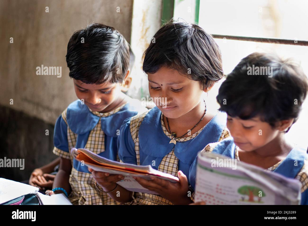 school Students studying in classroom Stock Photo