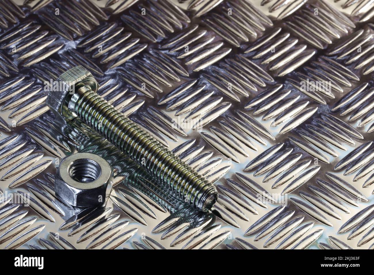 Threaded Hex Nut And Bolt On Tread Plate Stock Photo Alamy