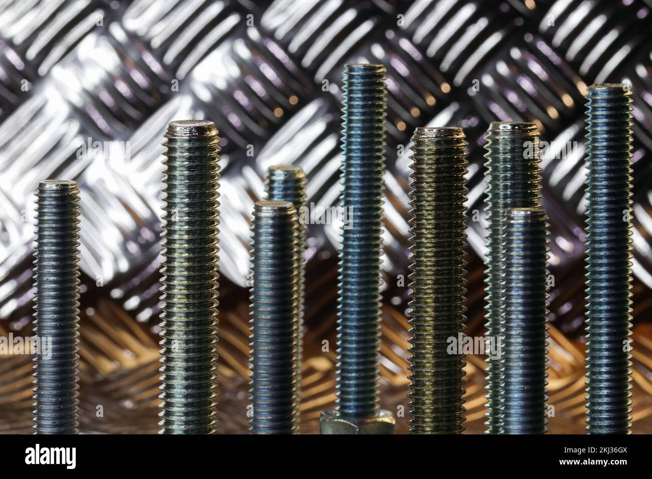 Threaded Steel Bolts With Metallic Plate Backdrop Stock Photo Alamy