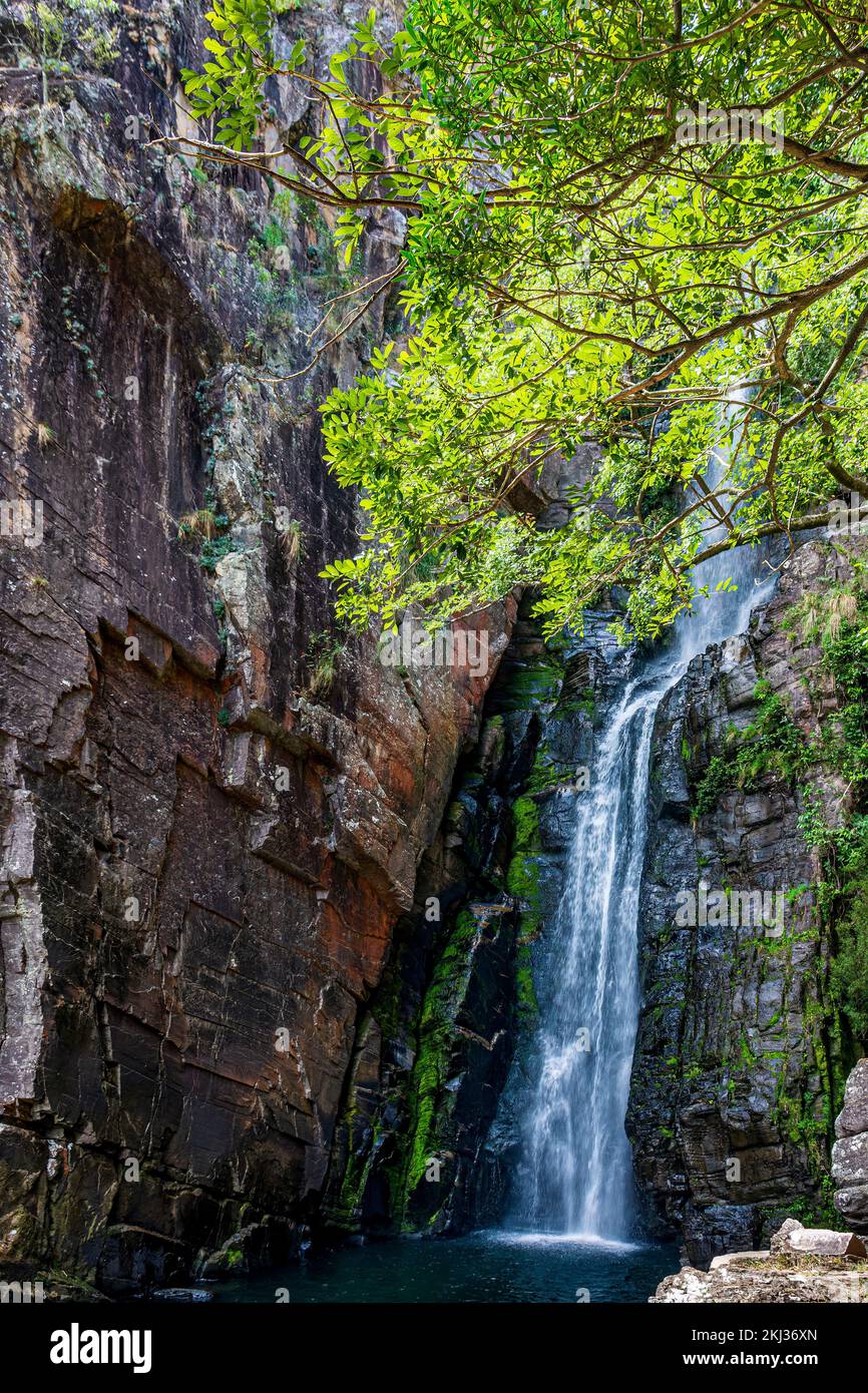 Waterfall between rocks with moss and preserved vegetation in Serra do Cipo in Minas Gerias Stock Photo
