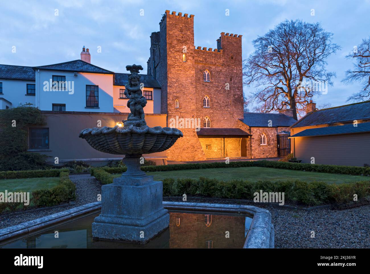 Ireland, County Kildare,Straffan, Barberstown Castle, exterior illuminated at dawn Stock Photo